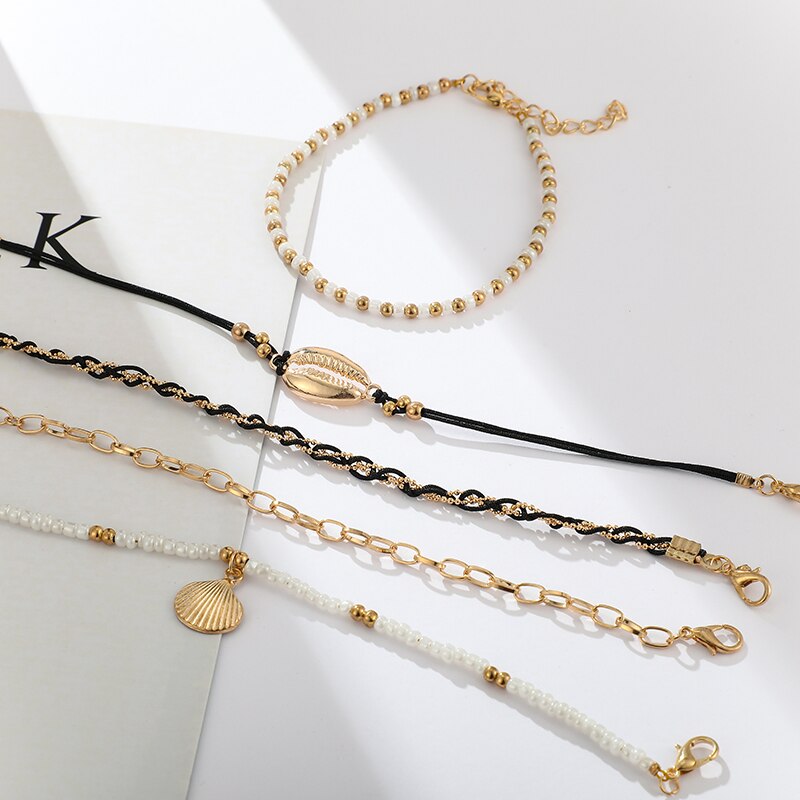 5-teiliges Fußkettchen Set schwarz, gold weiß Muschel