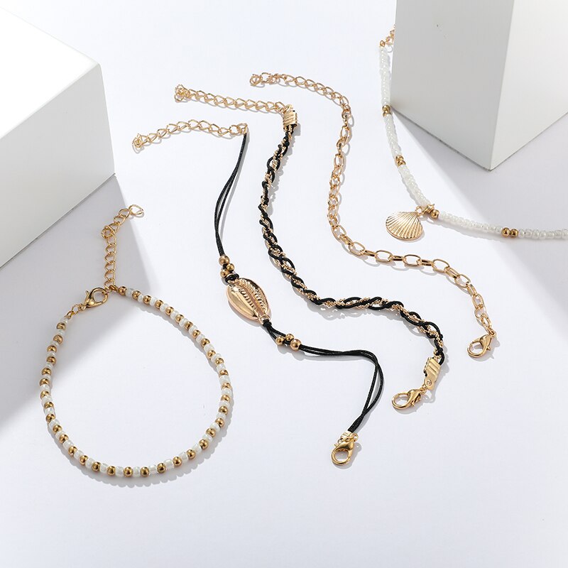 5-teiliges Fußkettchen Set schwarz, gold weiß Muschel