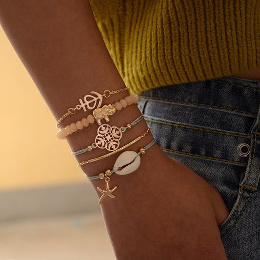 5-teiliges goldfarbenes Armband Set für Damen mit Muschel Seestern Elefant und dekorativen Anhängern