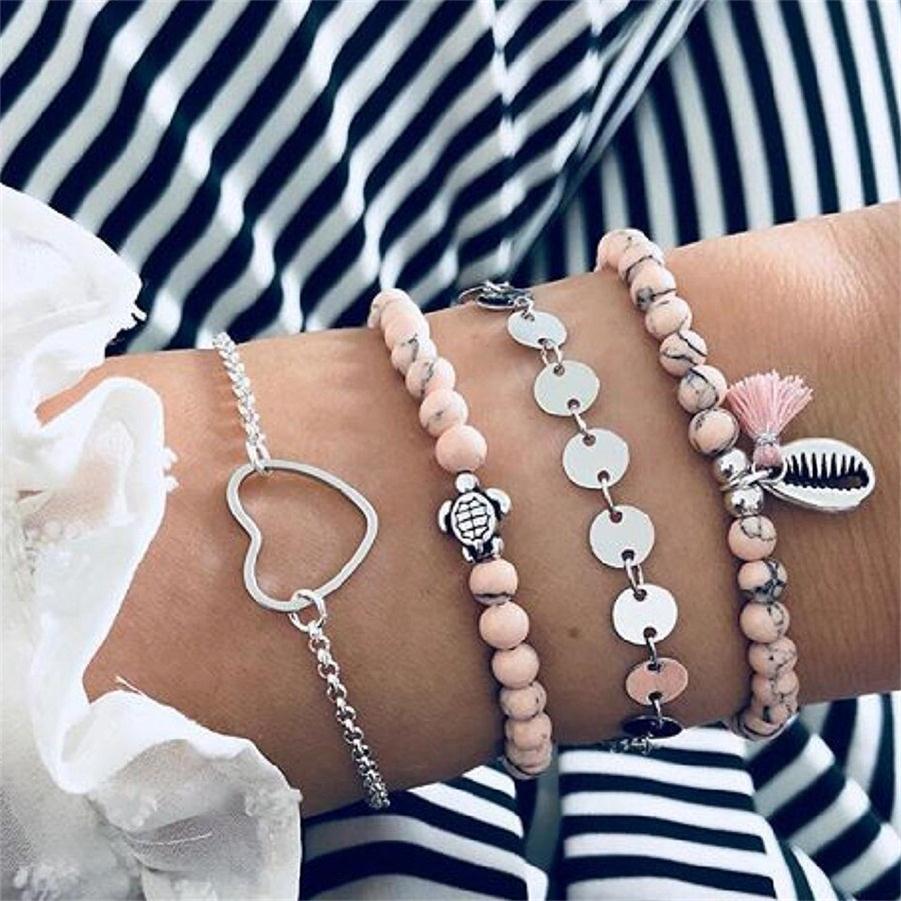 4-teiliges Armband Set für Damen in Rosa und Silber mit dekorativen Anhängern